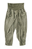 Loose, wrinkled italian fashion style olive women's trousers pants, isolated