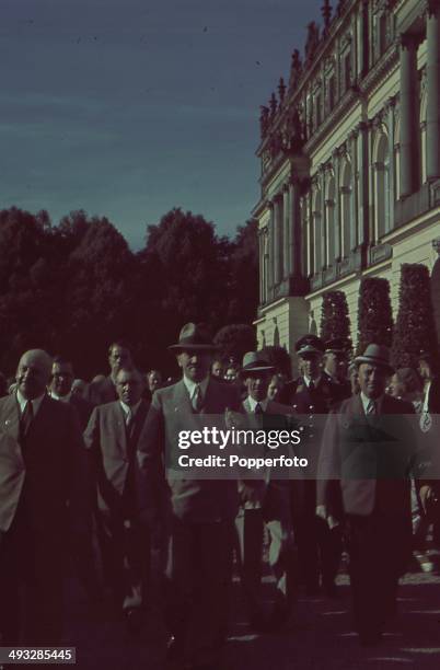 German Chancellor Adolf Hitler walks with Robert Ley , Joseph Goebbels and Martin Bormann along with other senior figures circa 1935.