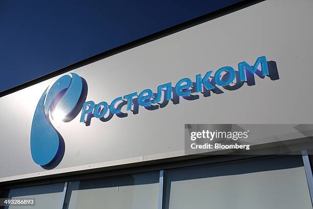 Logo stands on display outside the OAO Rostelecom pavilion at the St. Petersburg International Economic Forum in Saint Petersburg, Russia, on...