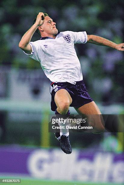 England player Paul Gascoigne celebrates after supplying the ball for David Platt to score the winning goal during the 1990 World Cup match between...