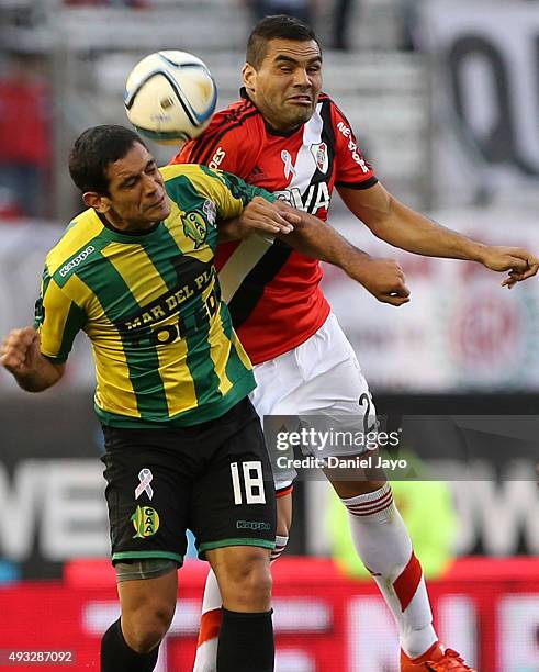Jose Sand of Aldosivi and Gabriel Mercado of River Plate go for a header during a match between River Plate and Aldosivi as part of round 28 of...