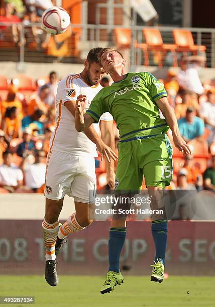 Dylan Remic of the Seattle Sounders FC and Will Bruin of the Houston Dynamo battle for the ball in the first half of their game at BBVA Compass...