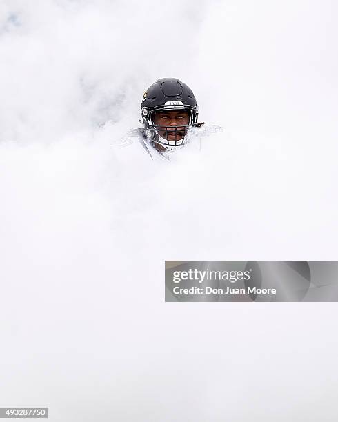 Guard A.J. Cann of the Jacksonville Jaguars emerges from a cloud of smoke during the team's intro before the game against the Houston Texans at...