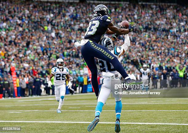 Ricardo Lockette of the Seattle Seahawks makes a touchdown catch over Kurt Coleman of the Carolina Panthers at CenturyLink Field on October 18, 2015...