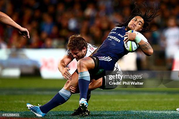 Ma'a Nonu of the Blues is tackled during the round 15 Super Rugby match between the Blues and the Sharks at North Harbour Stadium on May 23, 2014 in...