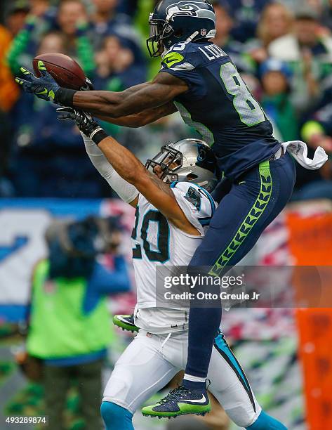 Wide receiver Ricardo Lockette of the Seattle Seahawks makes a catch for a touchdown against defensive back Kurt Coleman of the Carolina Panthers in...
