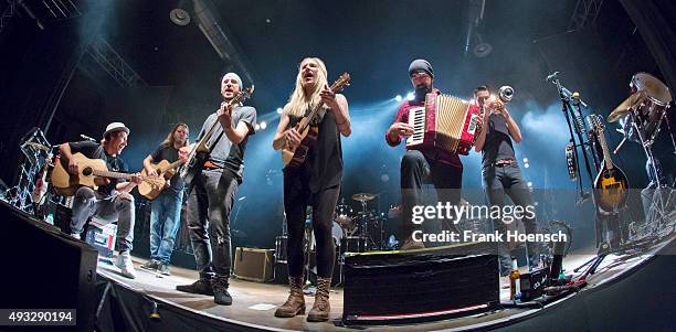 Members of the Canadian band Walk off the Earth perform live during a concert at the Huxleys on October 18, 2015 in Berlin, Germany.