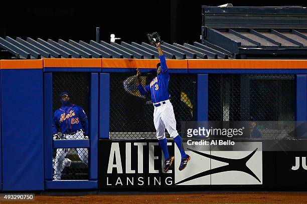 Curtis Granderson of the New York Mets catches a pop up fly hit by Chris Coghlan of the Chicago Cubs in the second inning against Noah Syndergaard of...