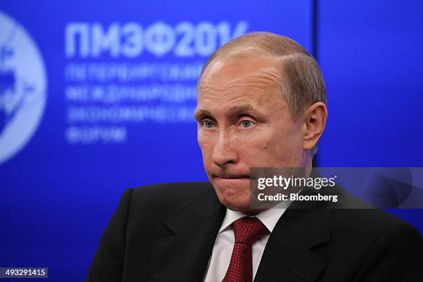 Vladimir Putin, Russia's president, pauses during a global business leaders summit at the St. Petersburg International Economic Forum in Saint...