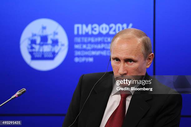 Vladimir Putin, Russia's president, listens to questions during a global business leaders summit at the St. Petersburg International Economic Forum...