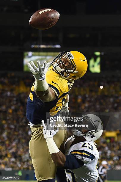 Richard Rodgers of the Green Bay Packers misses the pass while being defended by Darrell Stuckey of the San Diego Chargers in the fourth quarter at...