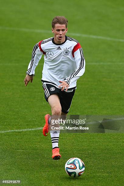 Erik Durm runs with a ball during a training session at the Germany pre-World Cup Training Camp at St Martin training ground on May 23, 2014 in St...