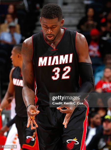 James Ennis of the Miami Heat reacts after hitting a back-to-back three-point basket against the Atlanta Hawks at Philips Arena on October 18, 2015...