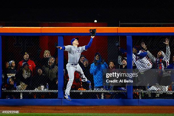 Chris Coghlan of the Chicago Cubs catches a pop up fly hit by Yoenis Cespedes of the New York Mets in the sixth inning during game two of the 2015...