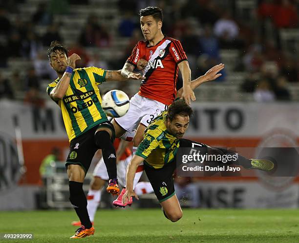 Mariano Seccafien, of Aldosivi, Sebastian Driussi, of River Plate, and Matias Lequi, of Aldosivi, fight for the ball during a match between River...