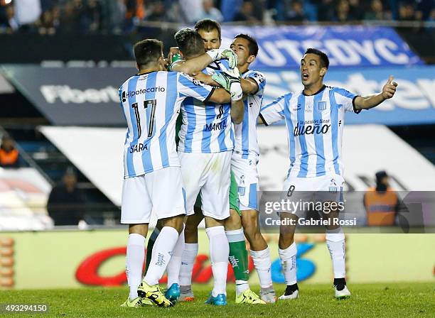 Sebastian Saja of Racing Club and teammates celebrate their team's third goal by a penalty kick during a match between Racing Club and Boca Juniors...