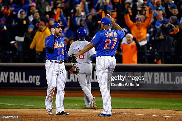 Jeurys Familia of the New York Mets celebrates the final out with Daniel Murphy after defeating the Chicago Cubs in game two of the 2015 MLB National...
