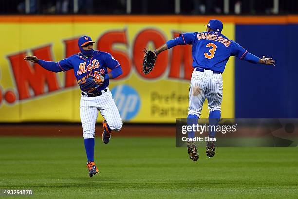 Yoenis Cespedes and Curtis Granderson of the New York Mets celebrate after defeating the Chicago Cubs in game two of the 2015 MLB National League...