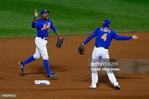 Curtis Granderson and Wilmer Flores of the New York Mets celebrate after defeating the Chicago Cubs in game two of the 2015 MLB National League...