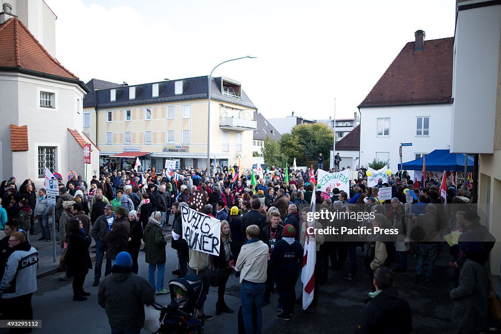 The counter protesters welcoming refugees during the...