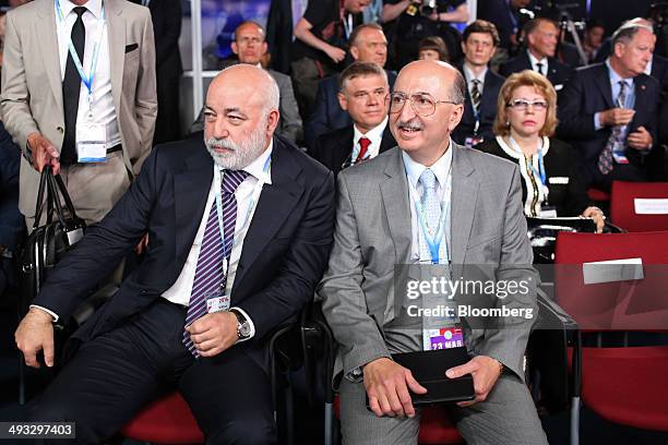 Viktor Vekselberg, a Russian billionaire, left, and David Yakobashvili, billionaire and chairman of Bioenergy Corp., right, wait for Russia's Prime...