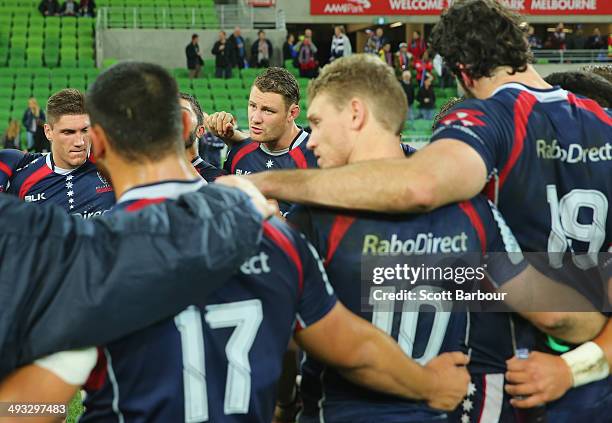 Scott Higginbotham, captain of the Rebels speaks his players after they lost the round 15 Super Rugby match between the Rebels and the Waratahs at...