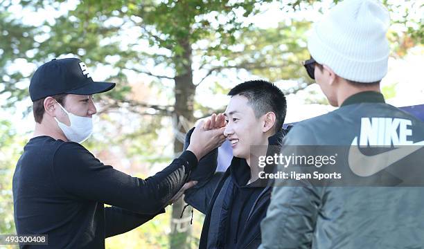 Kangin and Leeteuk of Super Junior see off their memebr Eunhyuk who joins the military service at 102nd division on October 13, 2015 in Seoul, South...