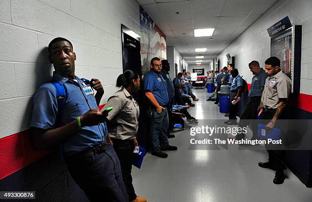 At the Lincoln Tech campus, Jadareous Davis waits with scores of other beginner students at 6:30am for the first class that began at 6:40am....