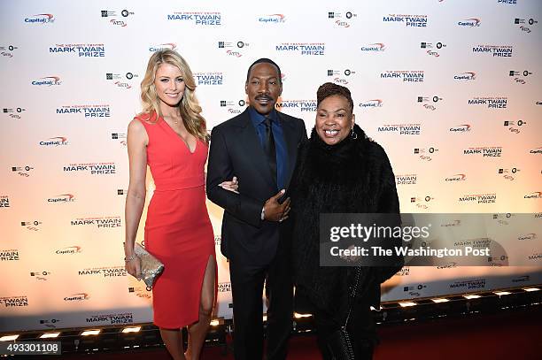 Paige Butcher, left, and Eddie Murphy, center, and Murphy's mother, Lillian Murphy, right are seen on the red carpet at the Kennedy Center for the...