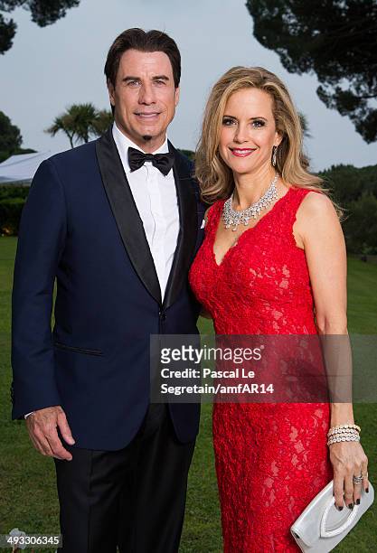 John Travolta and Kelly Preston pose for a portrait at amfAR's 21st Cinema Against AIDS Gala Presented By WORLDVIEW, BOLD FILMS, And BVLGARI at Hotel...