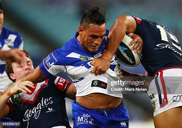 Reni Maitua of the Bulldogs is tackled during the round 11 NRL match between the Canterbury-Bankstown Bulldogs and the Sydney Roosters at ANZ Stadium...