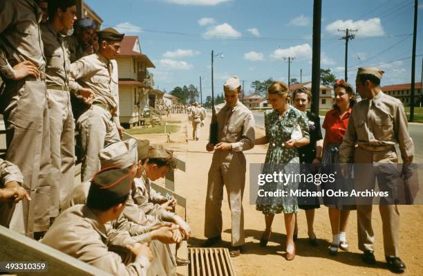 View of army soldiers off duty escort girls on base in Fayetteville, North Carolina in 1942.