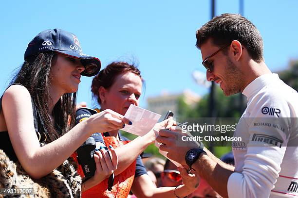 Jules Bianchi of France and Marussia signs autographs for the fans ahead of the Monaco Formula One Grand Prix at Circuit de Monaco on May 23, 2014 in...
