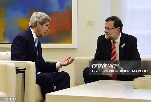 Secretary of State John Kerry speaks with Spanish Prime Minister Mariano Rajoy during a meeting at La Moncloa Palace in Madrid on October 19, 2015....