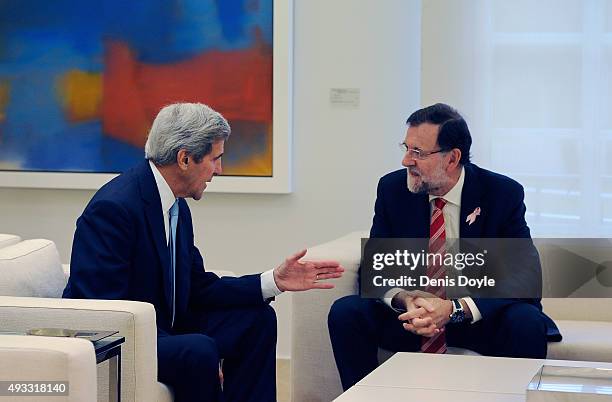 Spanish Prime Minister Mariano Rajoy chats with US Secretary of State John Kerry before their meeting at the Moncloa Palace on October 19, 2015 in...