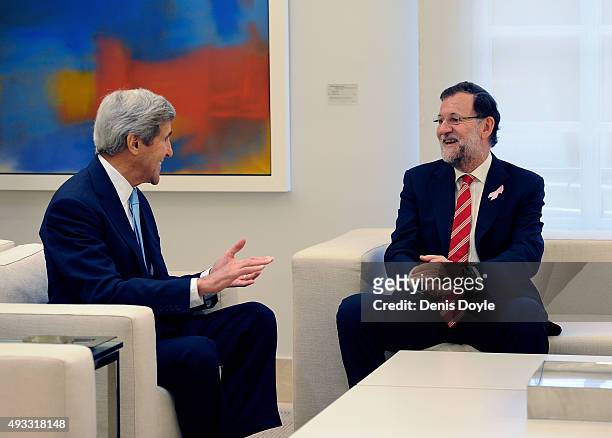 Spanish Prime Minister Mariano Rajoy chats with US Secretary of State John Kerry before their meeting at the Moncloa Palace on October 19, 2015 in...