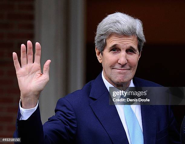 Secretary of State John Kerry waves before meeting with Spanish Prime Minister Mariano Rajoy at the Moncloa Palace on October 19, 2015 in Madrid,...