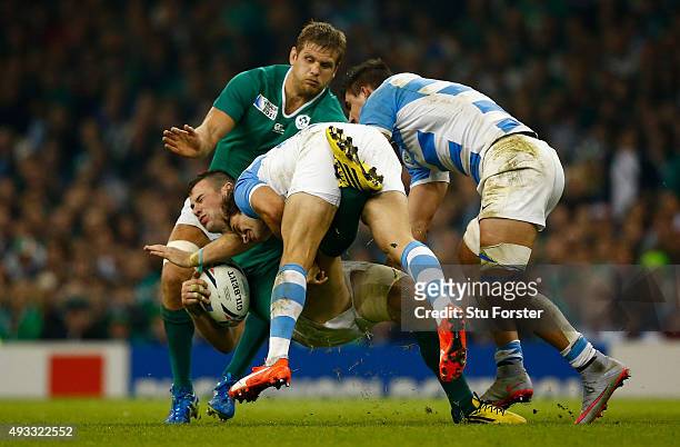 Ireland player Robbie Henshaw is tackled by Nicolas Sanchez during the 2015 Rugby World Cup Quarter Final match between Ireland and Argentina at...