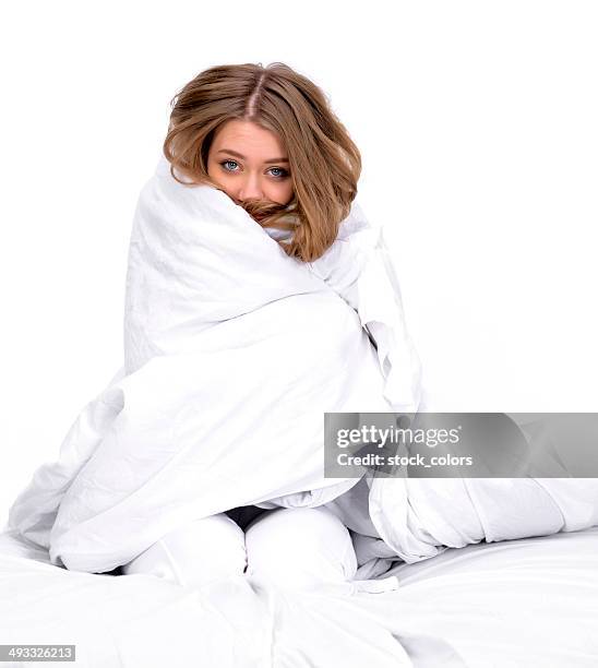 woman with blanket on her - bed on white background stock pictures, royalty-free photos & images