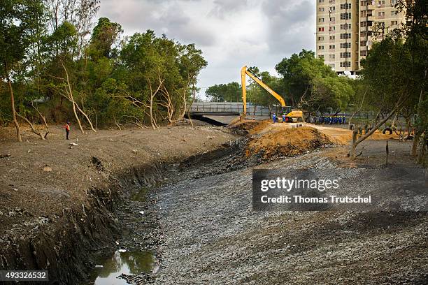 Beira, Mozambique An excavator digs for widening the riverbed and restoration of the retention area of the Rio Chiveve riverside on September 27,...