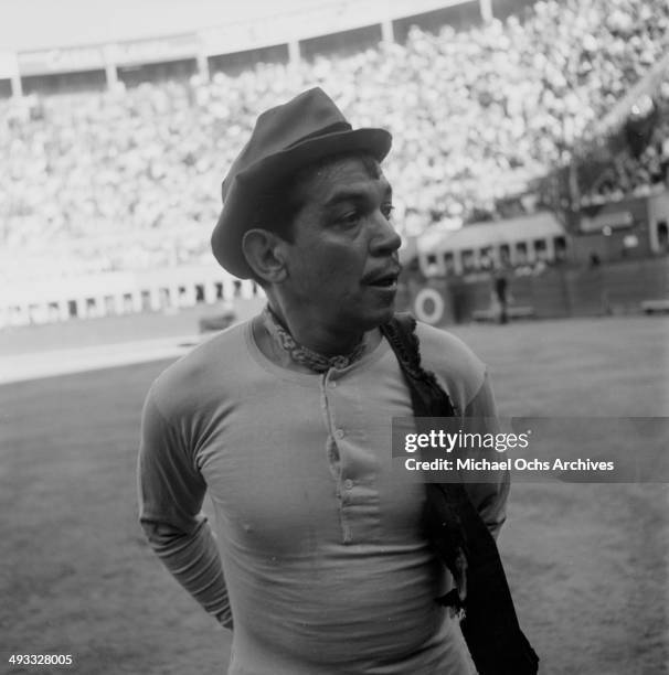 Mexican actor Cantinflas performs at bull fighting ring in Mexico.