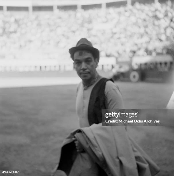 Mexican actor Cantinflas performs at bull fighting ring in Mexico.