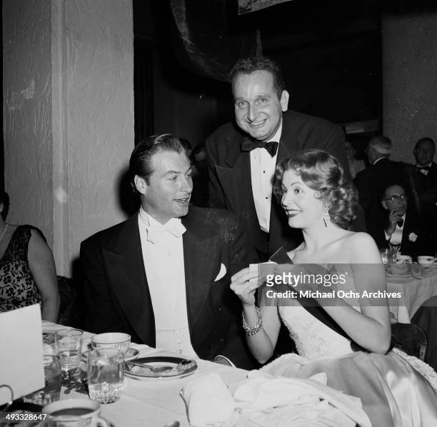 Actress Arlene Dahl with Lex Baker and Jose Jard attend the Foreign Press Awards in Los Angeles, California.