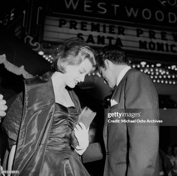 Actress Arlene Dahl and actor Fernando Lamas attends a premiere in Los Angeles, California.