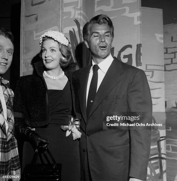 Actress Arlene Dahl and actor Fernando Lamas attend an opening in Los Angeles, California.