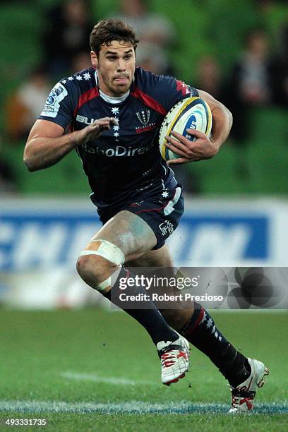 Tom English of the Rebels runs with the ball during the round 15 Super Rugby match between the Rebels and the Waratahs at AAMI Park on May 23, 2014...