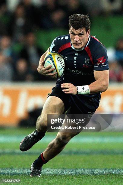 Mitch Inman of the Rebels runs with the ball during the round 15 Super Rugby match between the Rebels and the Waratahs at AAMI Park on May 23, 2014...