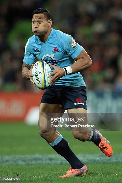 Israel Folau of the Waratahs runs with the ball during the round 15 Super Rugby match between the Rebels and the Waratahs at AAMI Park on May 23,...