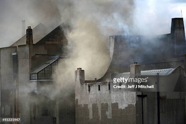 Smoke rises into the sky after a fire broke out at the Glasgow School of Art Charles Rennie Mackintosh Building on May 23, 2014 in Glasgow, Scotland....