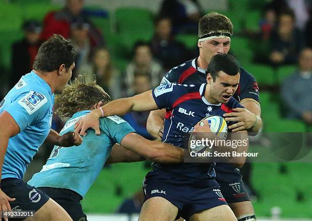 Jack Debreczeni of the Rebels is tackled during the round 15 Super Rugby match between the Rebels and the Waratahs at AAMI Park on May 23, 2014 in...